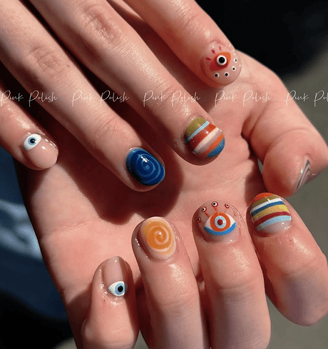 Colorful eye and rainbow nail art