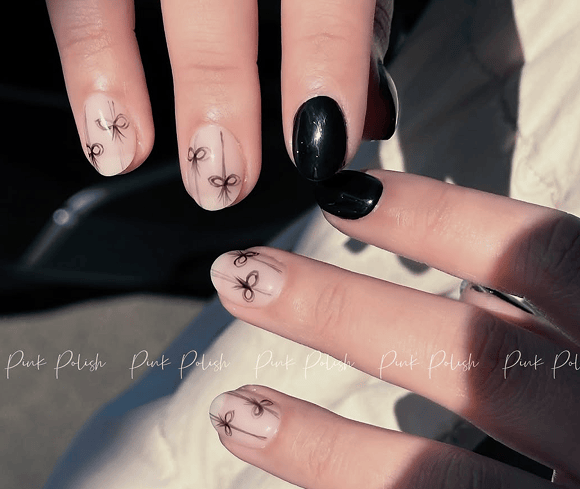 Black and white bow nail design