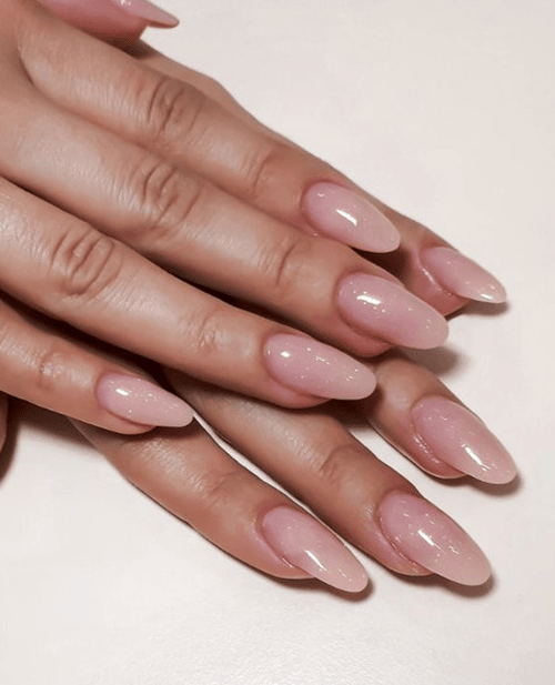 Hands with glossy hybrid gel manicure